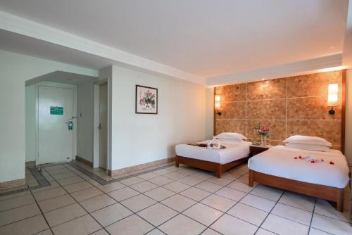 Imagen de la habitación del Hotel Palm Beach Resortandspa Sanya. Foto 8