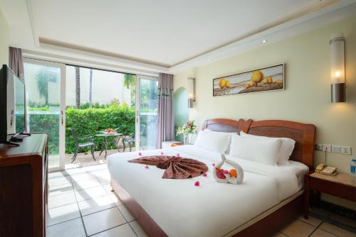 Imagen de la habitación del Hotel Palm Beach Resortandspa Sanya. Foto 10