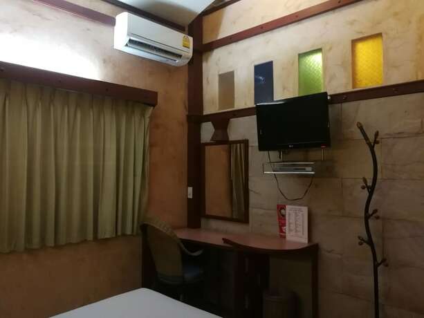 Imagen de la habitación del Hotel Palm Chalet Resort. Foto 17