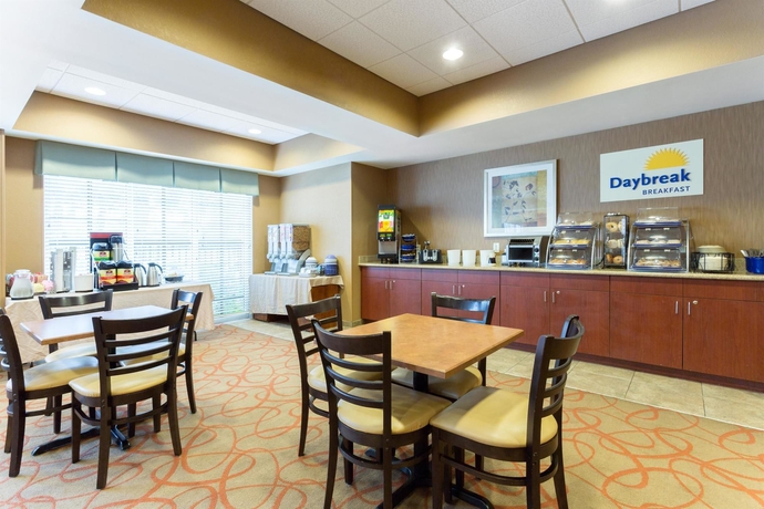 Imagen del bar/restaurante del Hotel Palm Coast and Suites. Foto 2