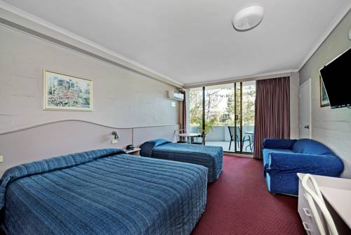 Imagen de la habitación del Hotel Palm Court Motor Inn. Foto 5