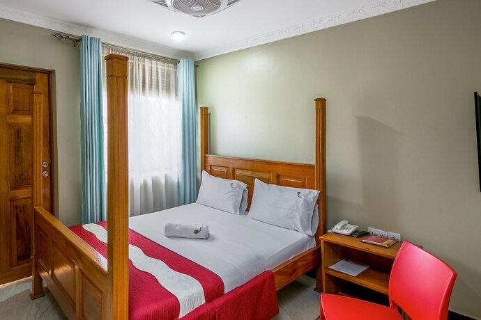 Imagen de la habitación del Hotel Palm Gardens and Guest House. Foto 17