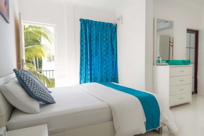 Imagen de la habitación del Hotel Palm Gate Maldives. Foto 14