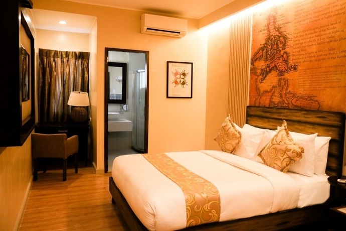 Imagen de la habitación del Hotel Palm Grass. Foto 8