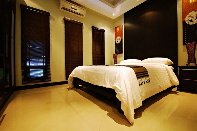 Imagen de la habitación del Hotel Palm Grove Resort. Foto 6