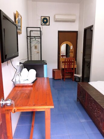 Imagen de la habitación del Hotel Palm House white building. Foto 16