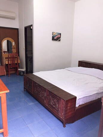 Imagen de la habitación del Hotel Palm House white building. Foto 17