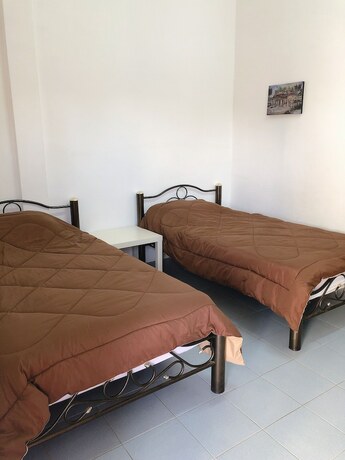 Imagen de la habitación del Hotel Palm House white building. Foto 18