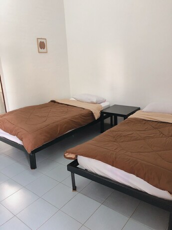 Imagen de la habitación del Hotel Palm House white building. Foto 19