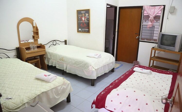 Imagen de la habitación del Hotel Palm House white building. Foto 20