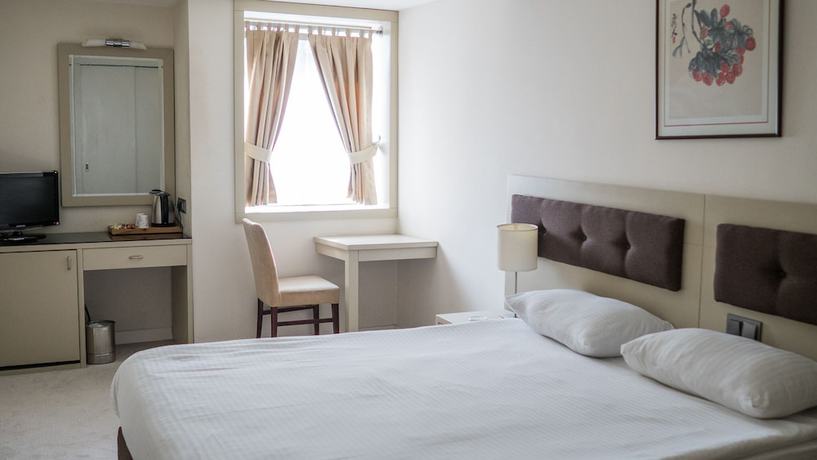 Imagen de la habitación del Hotel Palm Inn, ESMIRNA. Foto 6
