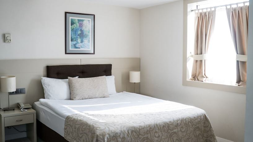 Imagen de la habitación del Hotel Palm Inn, ESMIRNA. Foto 7