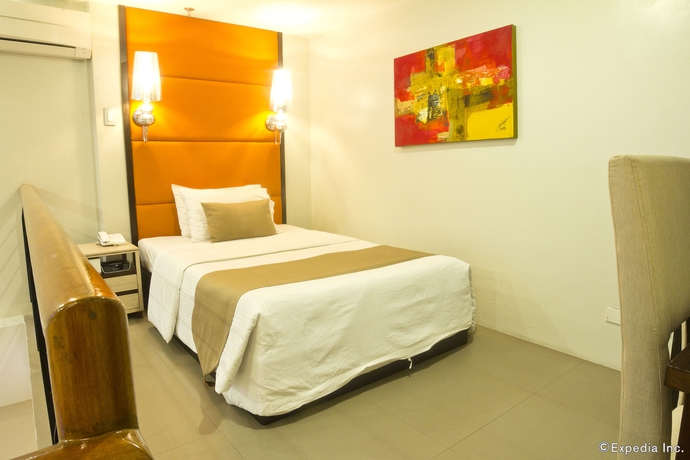 Imagen de la habitación del Hotel Palm Rock Residences. Foto 6