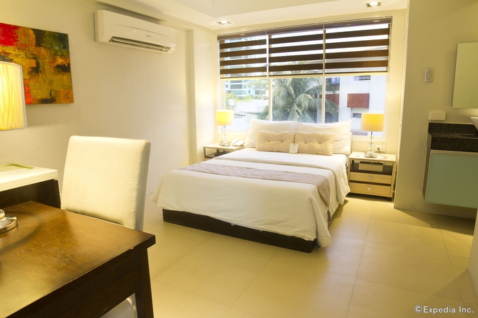 Imagen de la habitación del Hotel Palm Rock Residences. Foto 9