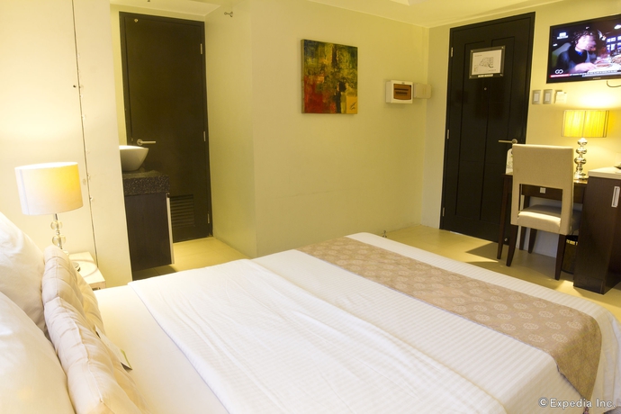 Imagen de la habitación del Hotel Palm Rock Residences. Foto 11