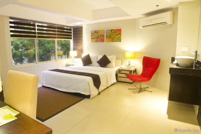 Imagen de la habitación del Hotel Palm Rock Residences. Foto 13