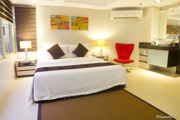 Imagen de la habitación del Hotel Palm Rock Residences. Foto 14