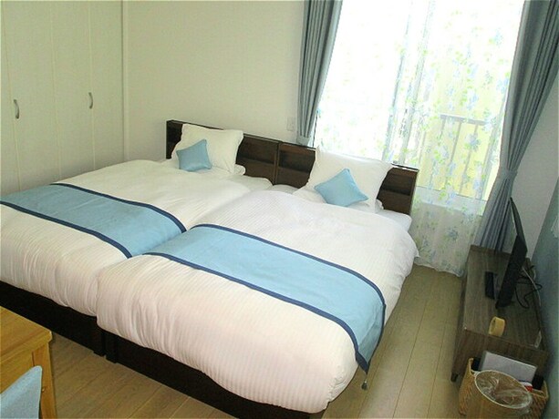 Imagen de la habitación del Hotel Palm Springs Miyakojima Resort. Foto 29