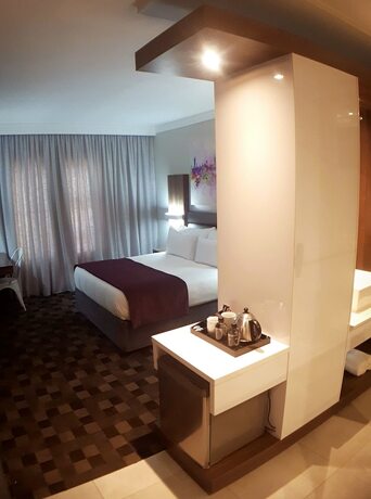 Imagen de la habitación del Hotel Palm Swift Luxury Accommodation. Foto 17