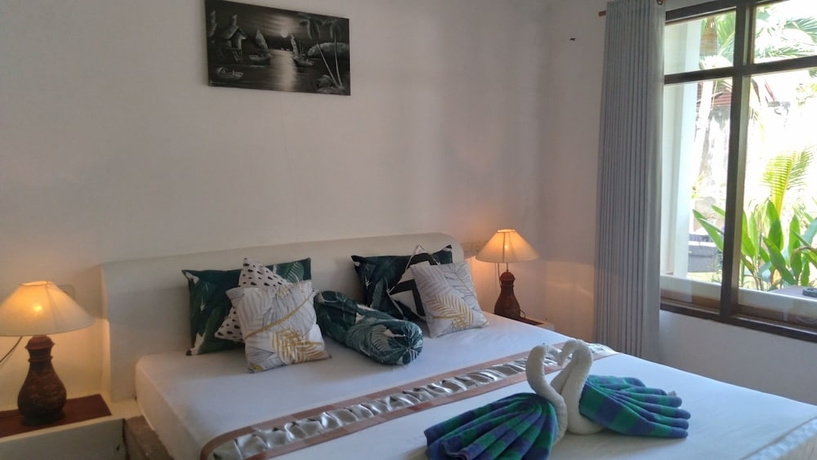 Imagen de la habitación del Hotel Palm Trees Villas. Foto 7