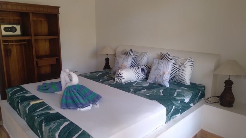 Imagen de la habitación del Hotel Palm Trees Villas. Foto 9