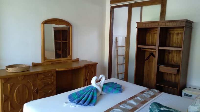 Imagen de la habitación del Hotel Palm Trees Villas. Foto 11