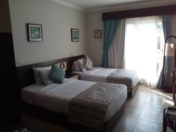 Imagen de la habitación del Hotel Palma Inn Resort. Foto 19
