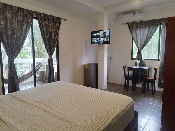 Imagen de la habitación del Hotel Palmendros hosteria. Foto 11