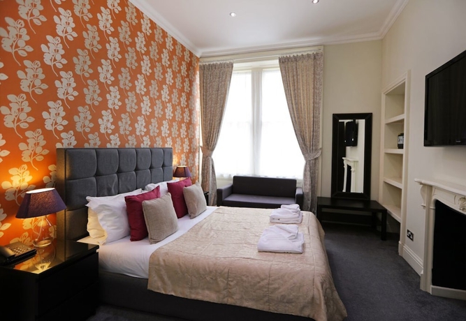 Imagen de la habitación del Hotel Palmerston Suites. Foto 2