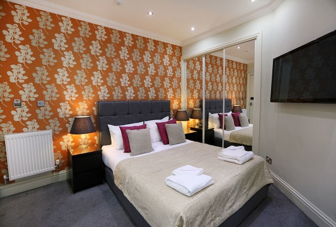 Imagen de la habitación del Hotel Palmerston Suites. Foto 6