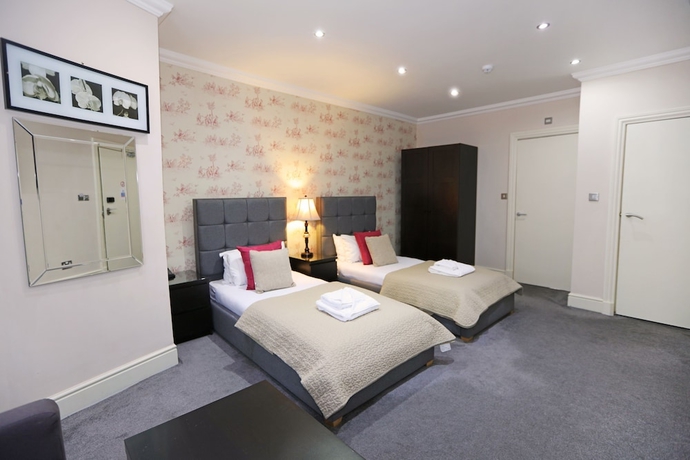 Imagen de la habitación del Hotel Palmerston Suites. Foto 10