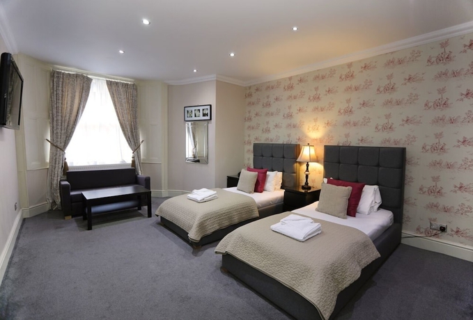 Imagen de la habitación del Hotel Palmerston Suites. Foto 11