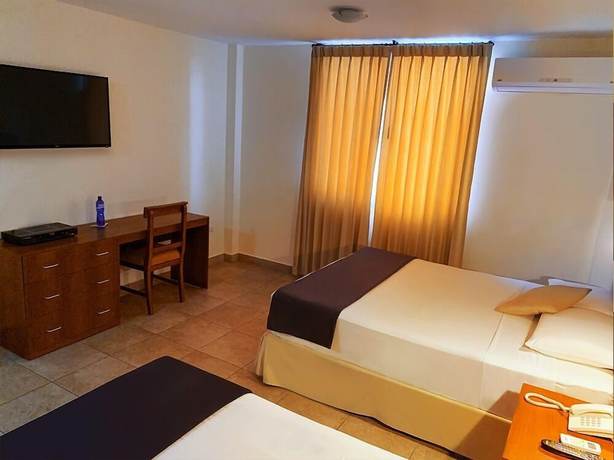 Imagen de la habitación del Hotel Palmira Inn. Foto 10