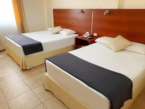 Imagen de la habitación del Hotel Palmira Inn. Foto 11