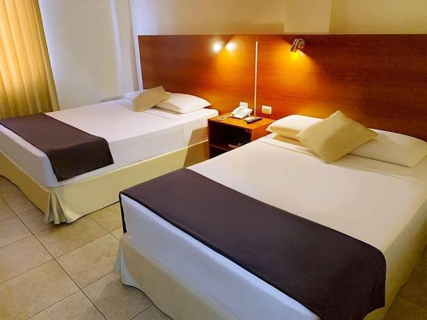 Imagen de la habitación del Hotel Palmira Inn. Foto 12
