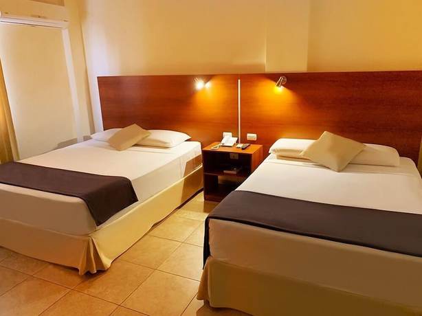 Imagen de la habitación del Hotel Palmira Inn. Foto 16