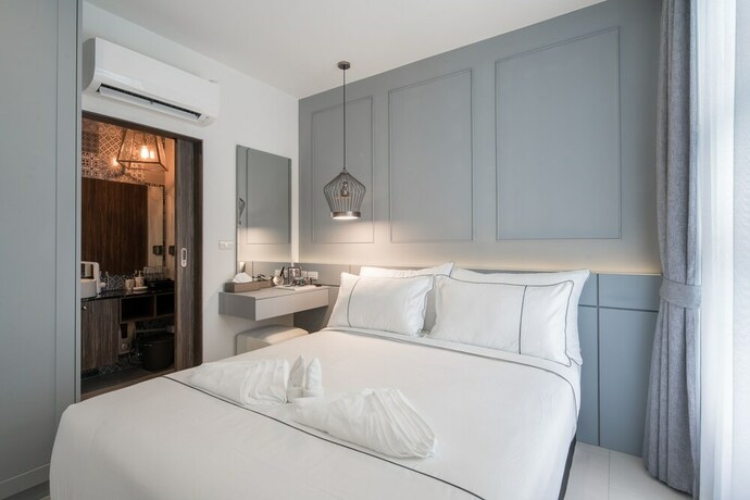 Imagen de la habitación del Hotel Palmyrah Surin Beach Residence. Foto 32