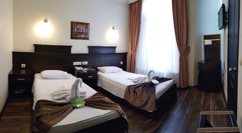 Imagen de la habitación del Hotel Pamuk City. Foto 11