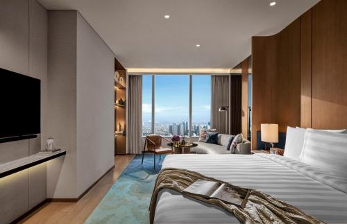 Imagen de la habitación del Hotel Pan Pacific Jakarta. Foto 14