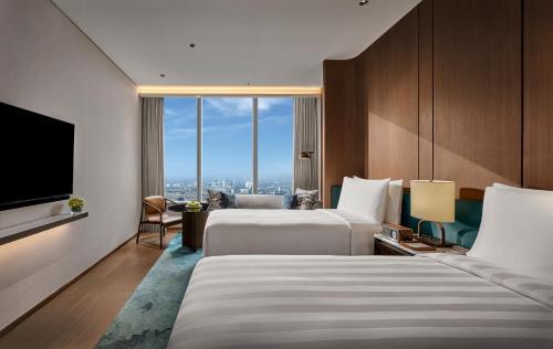Imagen de la habitación del Hotel Pan Pacific Jakarta. Foto 19