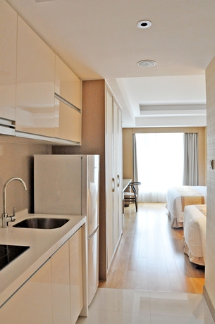 Imagen de la habitación del Hotel Pan Pacific Serviced Suites Ningbo. Foto 4