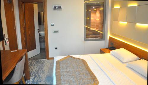 Imagen de la habitación del Hotel Panorama Damla Otel. Foto 2