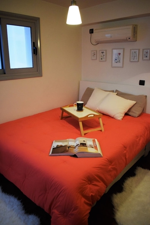 Imagen de la habitación del Hotel Panorama Penthouse and Studios. Foto 15