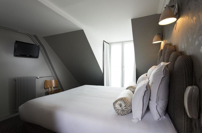 Imagen de la habitación del Hotel Paradis, París. Foto 8