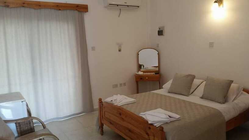 Imagen de la habitación del Hotel Paradise Holiday Bungalows. Foto 18