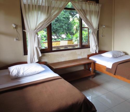 Imagen de la habitación del Hotel Paradise Palm Beach Bungalows And Dive Center. Foto 6