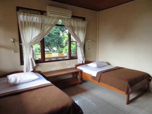Imagen de la habitación del Hotel Paradise Palm Beach Bungalows And Dive Center. Foto 7