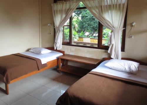 Imagen de la habitación del Hotel Paradise Palm Beach Bungalows And Dive Center. Foto 8