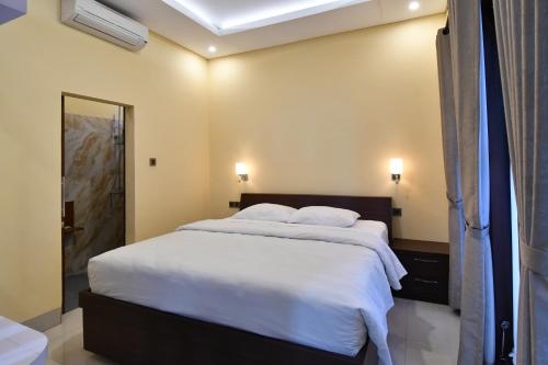 Imagen de la habitación del Hotel Paradise Palm Beach Bungalows And Dive Center. Foto 10