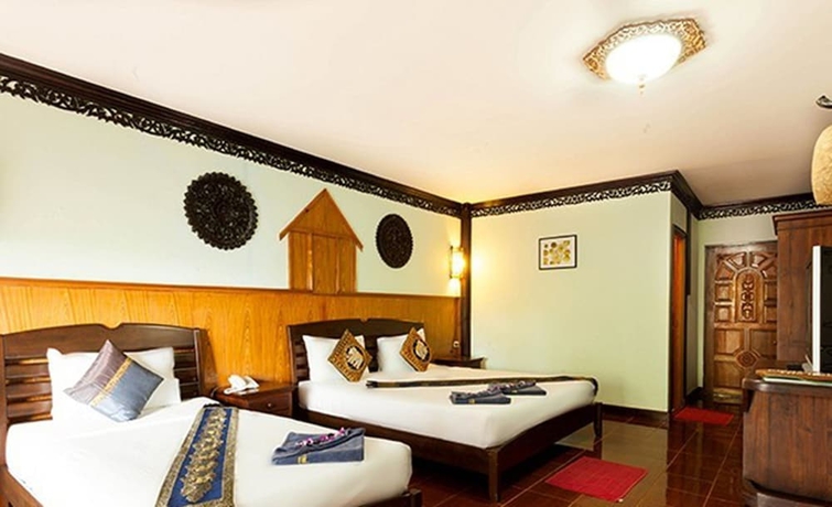 Imagen de la habitación del Hotel Paradise Pearl Bungalow. Foto 16